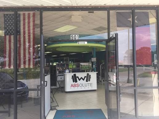 Entrance and front desk at Absolute Fitness in West Columbia, TX