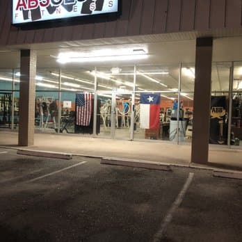 Absolute Fitness West Columbia storefront lit up at night