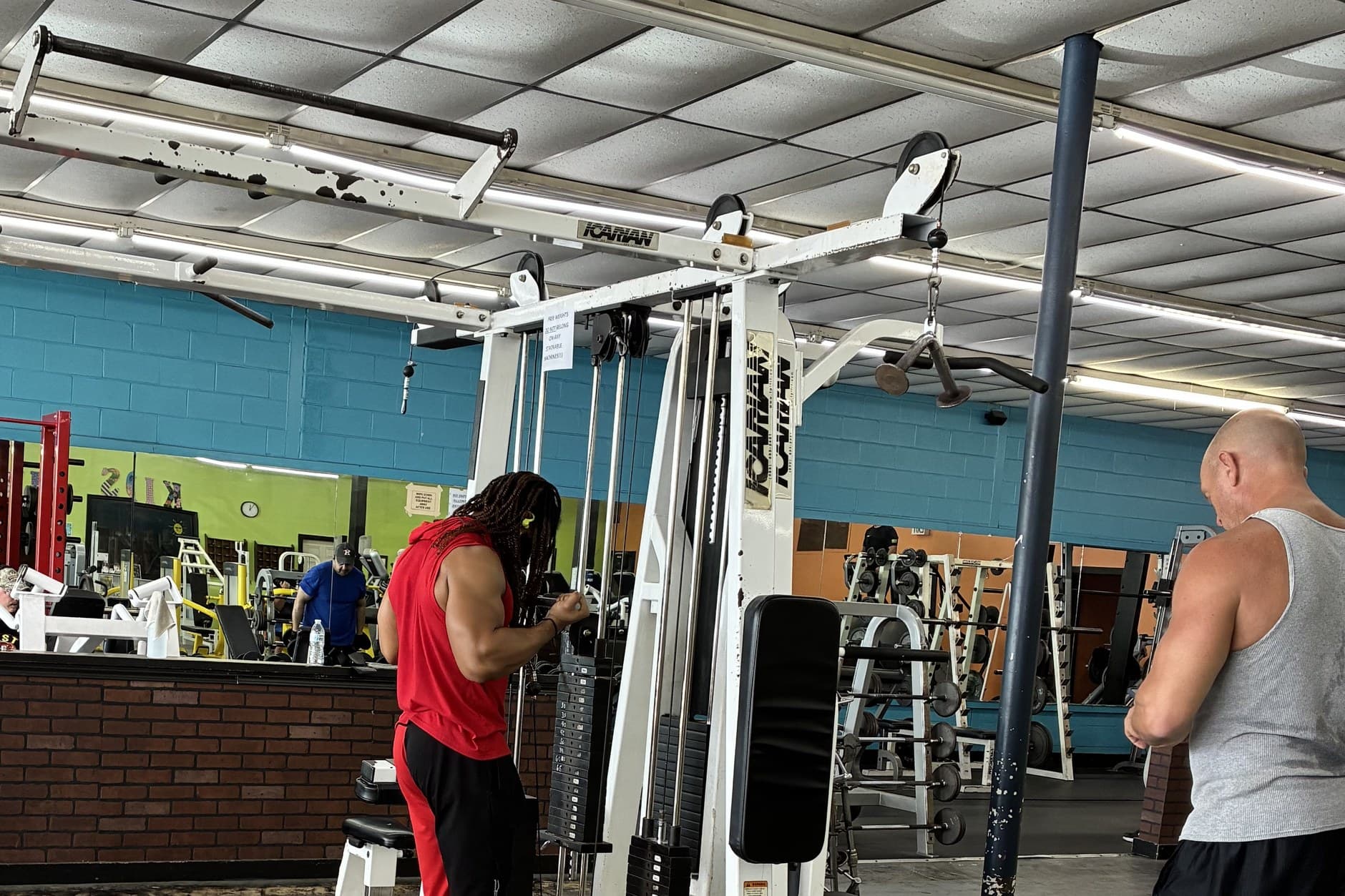 Two members training on the cable machine at Absolute Fitness